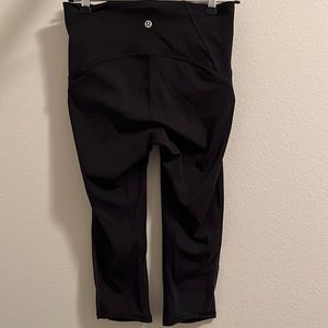 Lululemon black crop leggings with sheer side detail. Size 6